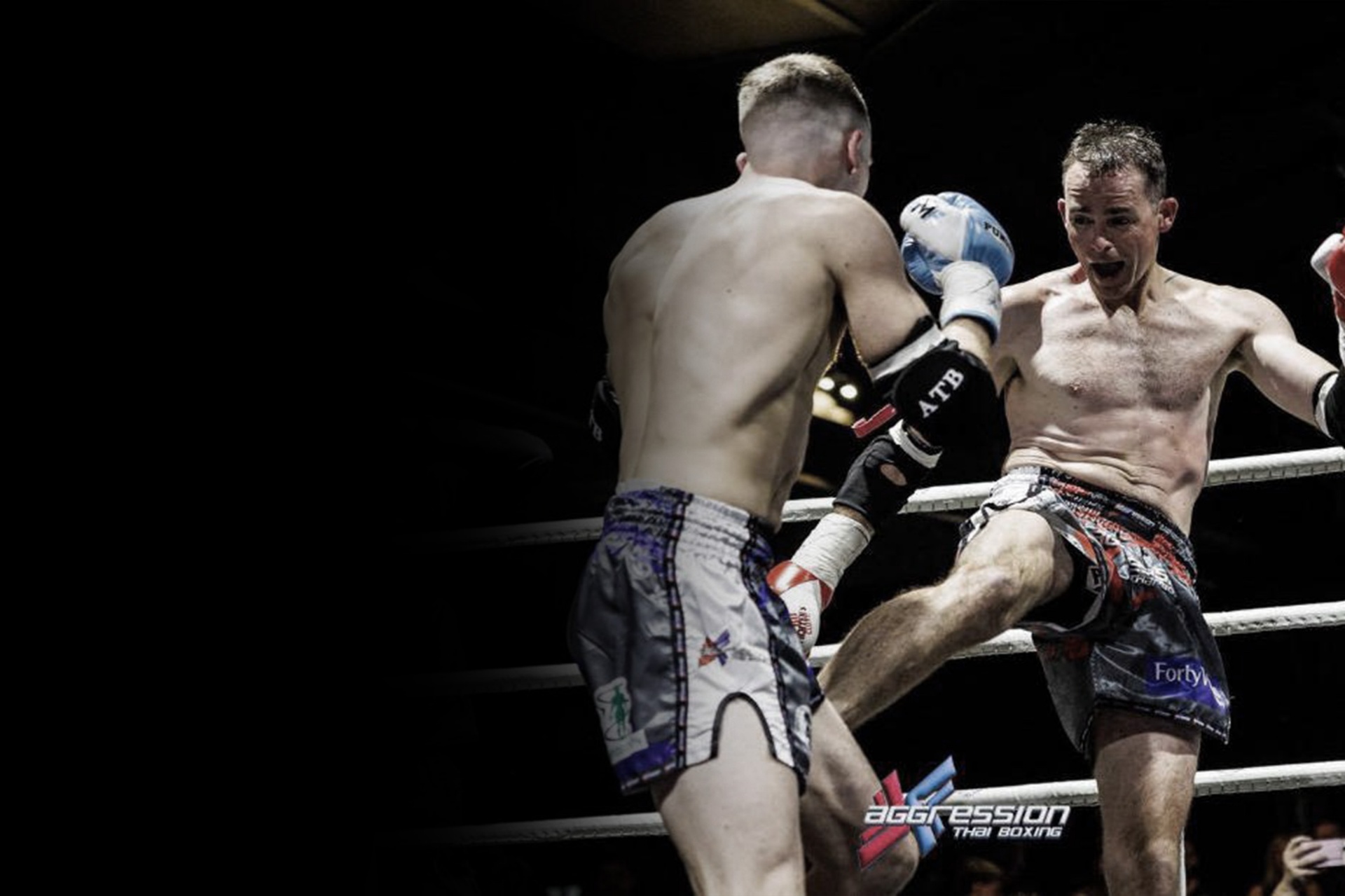 JTA Muay Thai fighter landing a teep in the ring